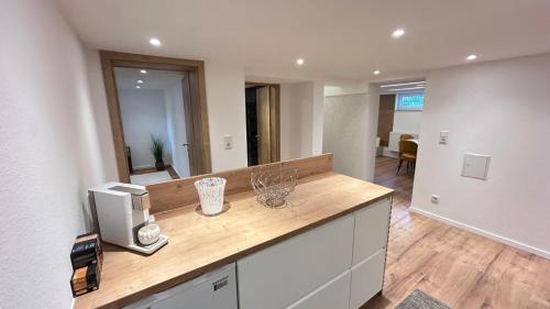 a kitchen with a counter with a tv on it at Ferienwohnung Nella in Paderborn