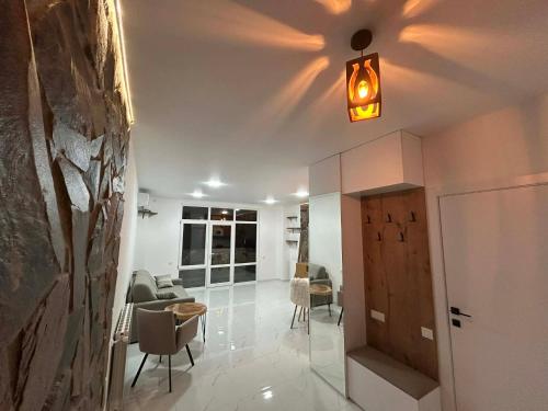 a living room with a couch and chairs and a light at Touch the Coast in Batumi