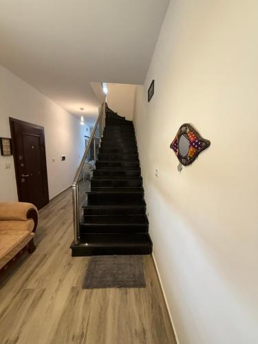 a staircase in a room with a stair case at Dar Zina in Mteurch