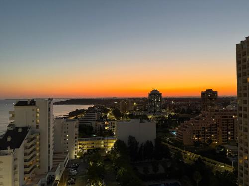 a view of a city skyline at sunset at Concorde Luxury Ocean View in Portimão