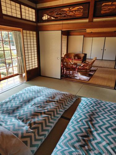 a large room with a large rug on the floor at 玉の浦sea in Nachikatsuura