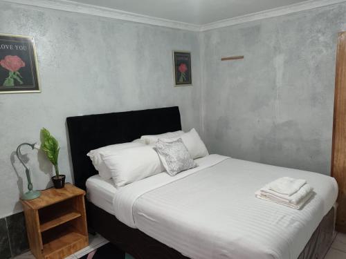 Llit o llits en una habitació de 399 Place