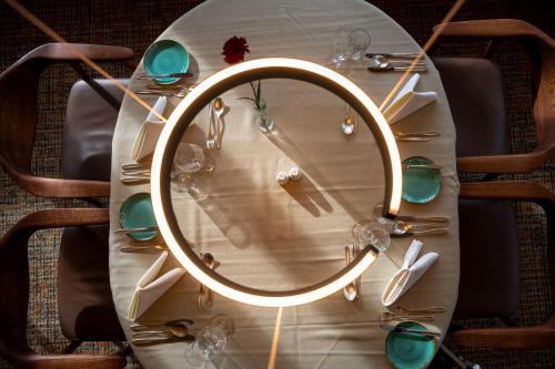 a table with a mirror on top of it at Wohlfühlhotel Hubertushof am Arlberg - Ski-In & Ski-Out - Sky Pool in Stuben am Arlberg