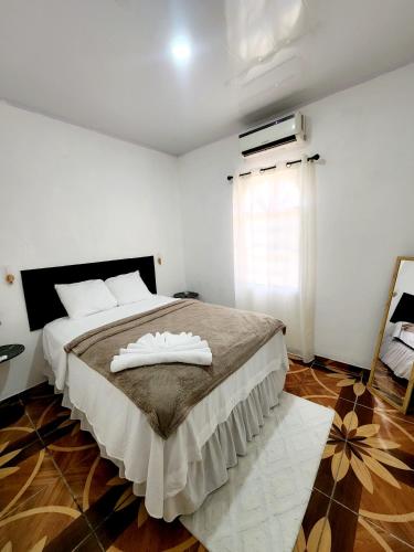 Casa Monarca 0301 tesisinde bir odada yatak veya yataklar