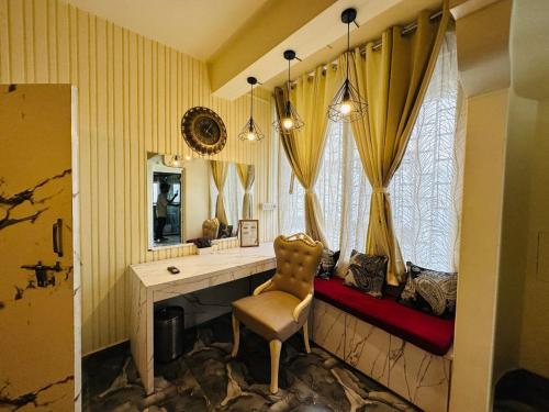 a room with a desk and a chair and a mirror at Velouria Homestay in Guwahati