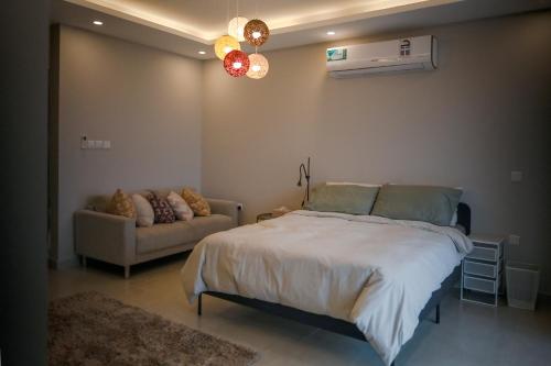 A bed or beds in a room at The Elevated Room