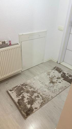 a white room with a rug on the floor at Molly Nest in Gjakove