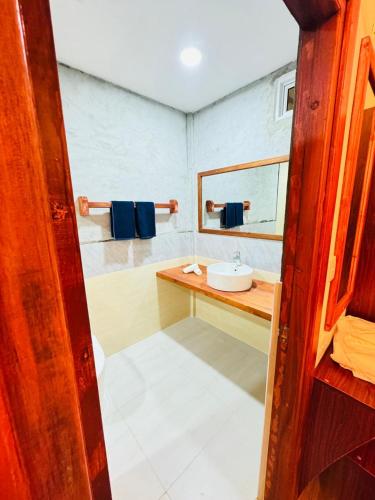 a bathroom with a sink and a mirror at Sevenseas Seaview Maldives in Feridhoo