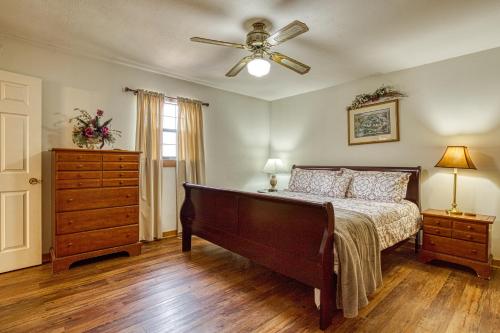 a bedroom with a bed and a ceiling fan at Amazing Grace-Cozy Cabin Retreat in the Smokies in Sevierville
