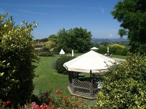 a white tent in the middle of a yard at Holiday Home in Montone with Pool & Garden in Montone