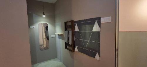 a bathroom with a sink and a mirror on the wall at Le Melur in George Town