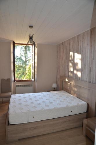 a bedroom with a large white bed in a room at Villa Les Myrtilles in Thonon-les-Bains