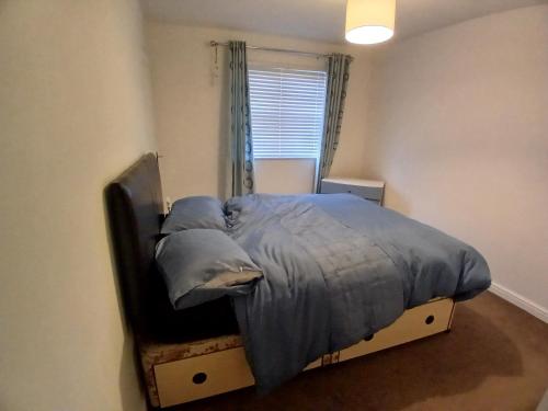 a bedroom with a bed in a room with a window at Double room Thornaby train station in Stockton-on-Tees