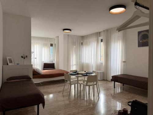 a living room with a bed and a table at 1402 Rooms in Matera