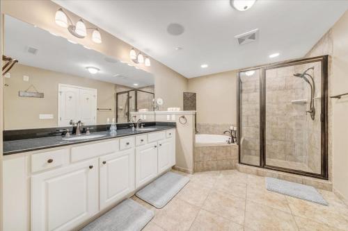 a bathroom with two sinks and a shower at Lake Stardust - Condo with pool ! Pet friendly in Moneta