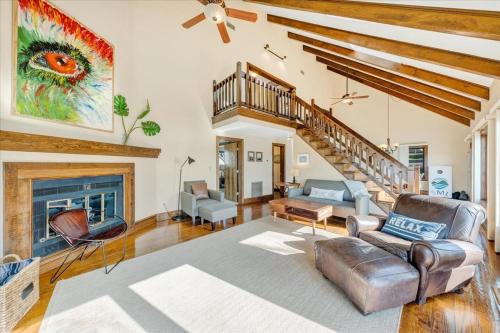 a living room with a couch and a fireplace at Pine Knob Point - Lakehouse w/ Private Dock in Moneta