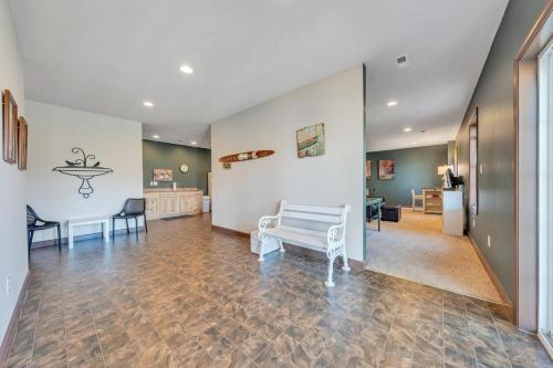 a living room with a white bench in a room at Whisper Haven - Private dock & Pet friendly in Moneta