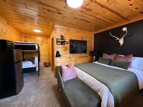 a bedroom with a bed and a couch in a room at A Night In Northfield in Hixton