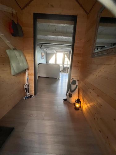 a room with a bed and a light on the floor at Villa Vannes in Skånevik