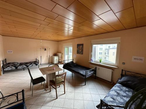a living room with a table and a couch at Ruhige Wohnung in Gelsenkirchen in Gelsenkirchen