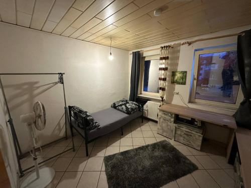 a small living room with a tv and a couch at Ruhige Wohnung in Gelsenkirchen in Gelsenkirchen
