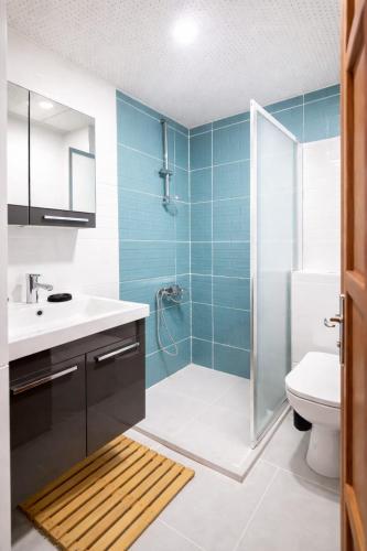 a bathroom with a shower and a sink and a toilet at Kavala Hotel Bodrum in Bodrum City