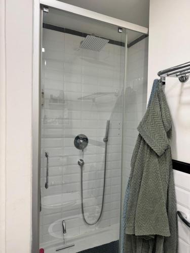 a shower with a glass door in a bathroom at Full casa 1 in Cosenza