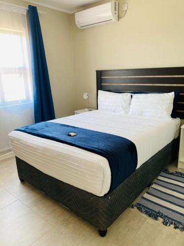 Llit o llits en una habitació de Ntombi's Place