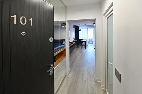 a door to a hallway with a living room at Lili's Studio 2 in Piteşti
