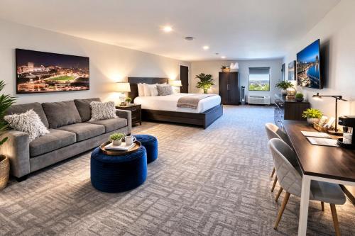 a living room with a couch and a bed at The 419 Ten-Room Boutique in Sandusky in Sandusky