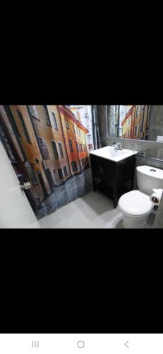 a bathroom with a toilet and a sink at Beautiful Beachview 2 Bebroom Loft at Sandcastles in Ocho Rios