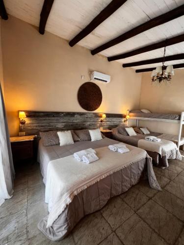 a bedroom with two beds in a room at Momocho in Esquina