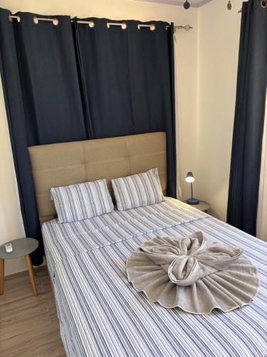 a bedroom with a bed with a large blanket at Orquídea de la Paz in Coco