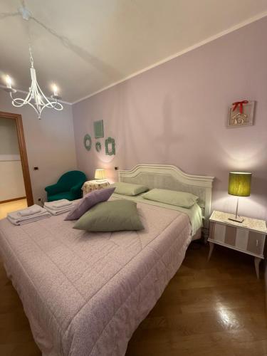 a bedroom with a large bed and two tables at La lavanda di Poppi-mini appartamento in Poppi