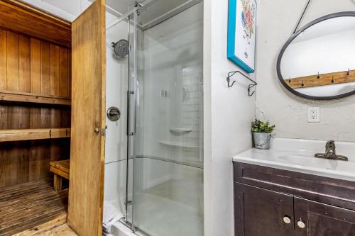 a bathroom with a shower and a sink at Mountain View-Backyard-Air-Conditioning-BBQ-15mins walk Blue Mountain Village in Blue Mountains