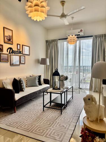 a living room with a couch and a table at daisy apartment taiping in Taiping