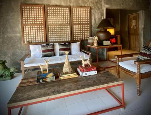 a living room with a couch and a table at Caba La Union Gulfside Cottage C2 in Caba