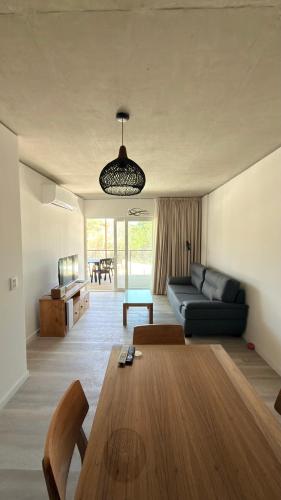 a living room with a couch and a table at Almarena La Reserva UF 112 in Costa del Este