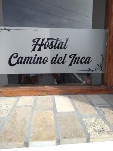 a sign that reads hospital canina del inca in a window at Camino del Inca in Cachí