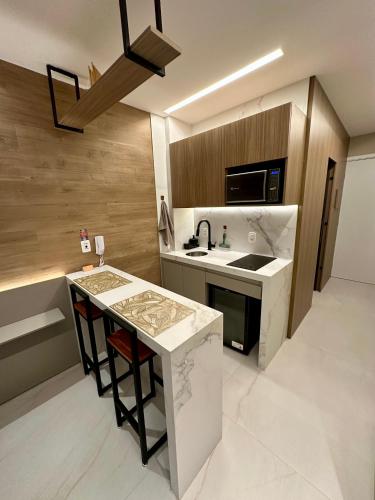 a kitchen with a sink and a counter top at Maré alta flat 213 in Tamandaré