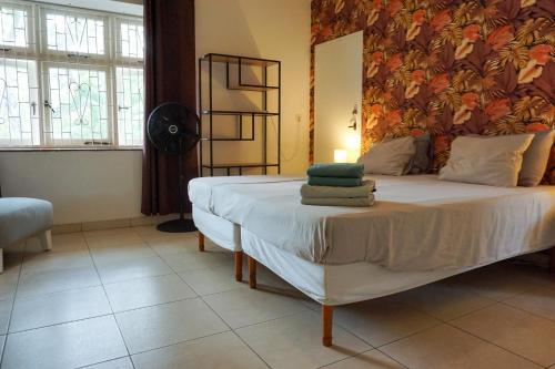Una cama o camas en una habitación de Abaai Resort B&B