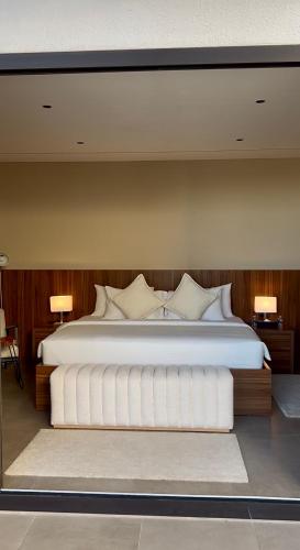 Giường trong phòng chung tại JA Accom
