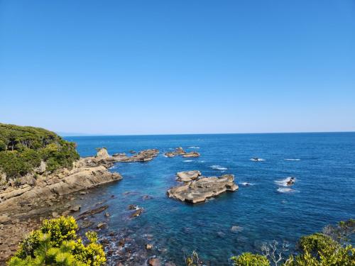 a group of rocks in a body of water at 古民家宿懐 in Nachikatsuura