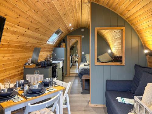 a living room with a couch and a table in a room at Swallow - Uk51347 in Draughton