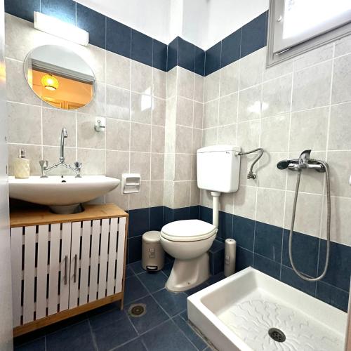 a bathroom with a toilet and a sink at Liberty Studio in Kallithea Halkidikis