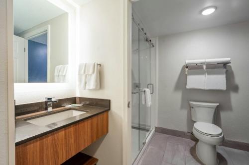 a bathroom with a sink and a toilet at Fairfield Inn & Suites by Marriott Atlanta Kennesaw in Kennesaw