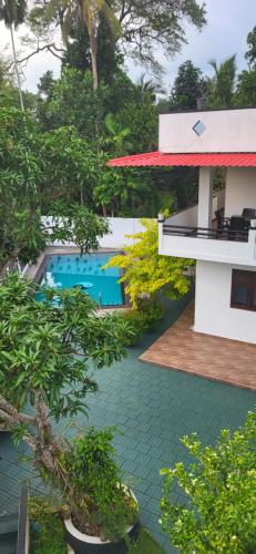 an aerial view of a resort with a swimming pool at Villa Olive in Hikkaduwa
