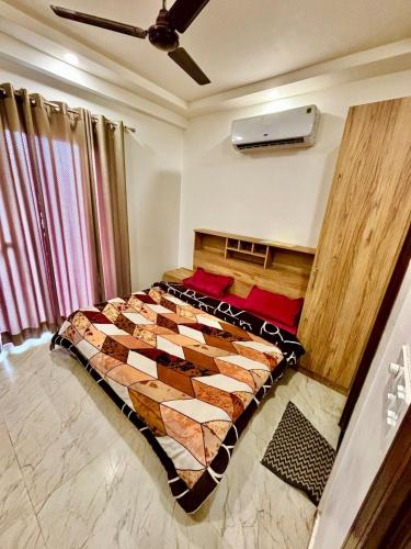 a bedroom with a large bed in a room at Mokshika Homes at Rishikesh in Birbhaddar