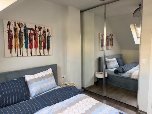 a bedroom with a bed and a glass wall at Luxury flat 2 in Pleven