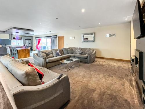 a living room with a couch and a table at The Wendover in Rowen
